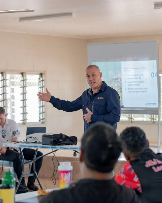 John Palmer, Managing Director of Emver Partners, facilitating a session in a community hall